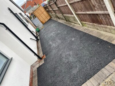 Quality Tarmac Driveway With A Featured Gravel Area With Black Ice Gravel With A Border And Circle For Planting contractors near Manchester
