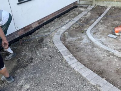 Quality Tarmac Driveway With A Featured Gravel Area With Black Ice Gravel With A Border And Circle For Planting contractors near Manchester