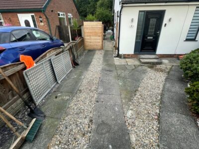 Local Tarmac Driveway With A Featured Gravel Area With Black Ice Gravel With A Border And Circle For Planting company in Manchester
