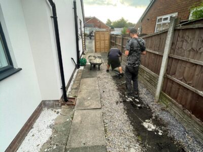 Tarmac Driveway With A Featured Gravel Area With Black Ice Gravel With A Border And Circle For Planting experts in Manchester