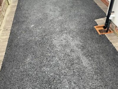 Experienced Tarmac Driveway With A Featured Gravel Area With Black Ice Gravel With A Border And Circle For Planting services in Manchester