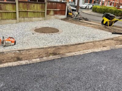 Tarmac Driveway With A Featured Gravel Area With Black Ice Gravel With A Border And Circle For Planting services near Manchester