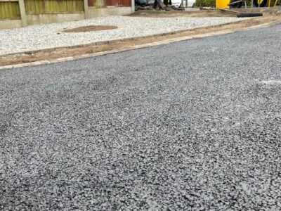 Manchester Tarmac Driveway With A Featured Gravel Area With Black Ice Gravel With A Border And Circle For Planting contractors