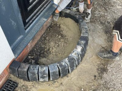 Quality Tarmac Driveway With A Featured Gravel Area With Black Ice Gravel With A Border And Circle For Planting near Manchester