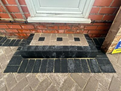 Block paved steps with charcoal edging