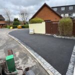 Tarmacadam drives Manchester